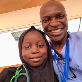 Cheedy Jaja and child at Sierra Leone clinic